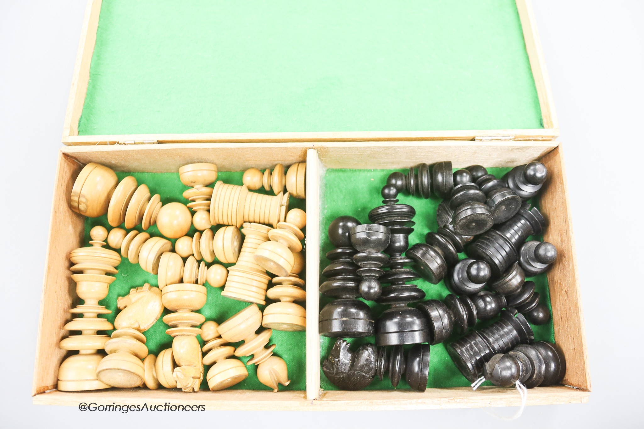 A Boxwood and ebony chess set, in a later box
